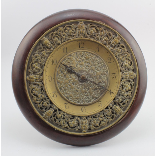 304 - Brass ornately decorated clock, engraved 'Russells, 35 Piccadilly W.', Arabic numerals, easel back, ... 