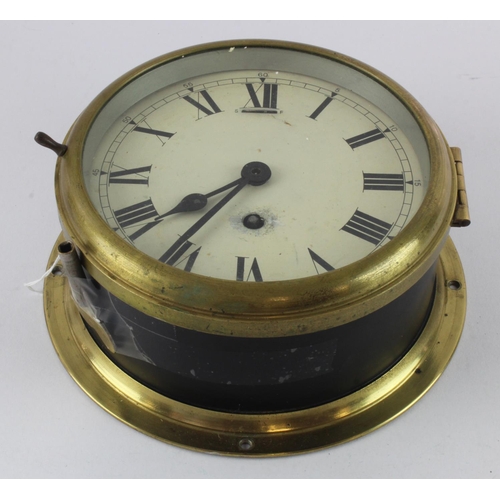 314 - Ships bulkhead clock with Roman numerals to dial, key present, diameter 19.5cm approx. (working at t... 