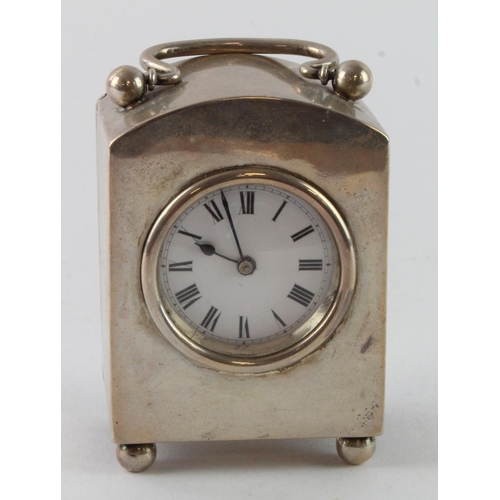 315 - Silver carriage clock, raised on four ball feet, hallmarked 'W.N.G.N., Birmingham 1911', white ename... 