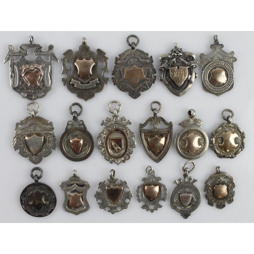 317 - Assortment of seventeen silver fob medals/pendants, all with a full silver hallmark. Gross weight 15... 