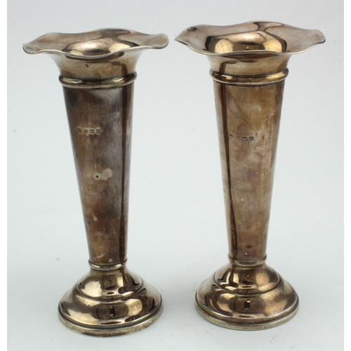 318 - Pair of silver fluted flower vases, hallmarked 'Birmingham 1919', weighted bases, height 18cm approx... 