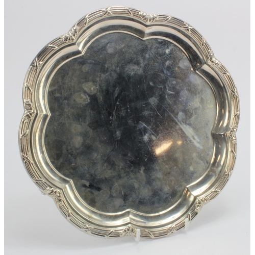 334 - Silver salver raised on three feet, hallmarked 'MH&CoLd, Sheffield 1912', diameter 26.5cm approx., w... 