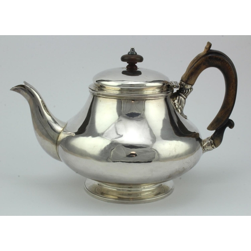 335 - George IV silver teapot with worn wooden handle and wooden finial, bears worn hallmarks for Robert H... 