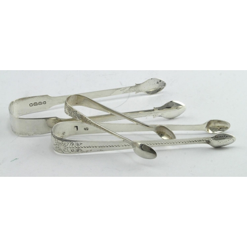 346 - Three pairs of silver sugar tongs, comprising two Georgian pairs - one is bright cut and hallmarked ... 