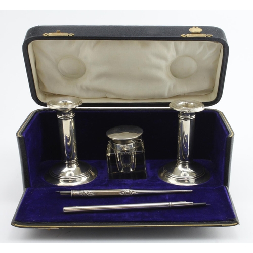 357 - Composite silver pen set comprising two small candlesticks with damaged tops, a silver and glass ink... 