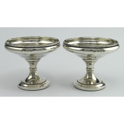 396 - Pair of pedestal footed silver bon-bon dishes, both have loaded bases, hallmarked ATC Birm, 1972.