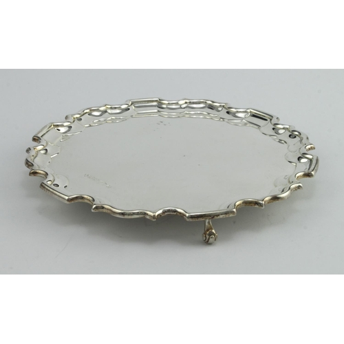 405 - Silver salver (no inscription) with scroll and pie-crust border on three scroll feet, hallmarked RC ... 