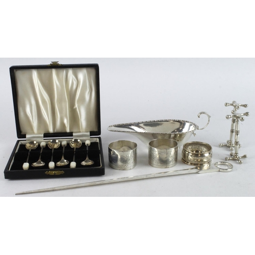 412 - Mixed Silver. A group of mostly mixed silver items, including letter opener, cream jug, napkin rings... 