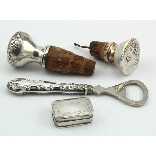 431 - Mixed lot of three silver mounted items comprising two silver topped bottle stoppers, both decorated... 