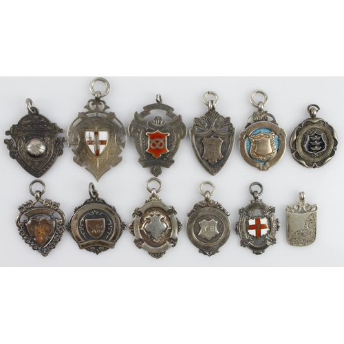 440 - Assortment of twelve silver fob medals/pendants, all with a full silver hallmark. Gross weight 121.3... 