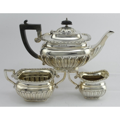 446 - Queen Anne style three piece silver tea set comprising teapot, sugar bowl and cream jug. All hallmar... 