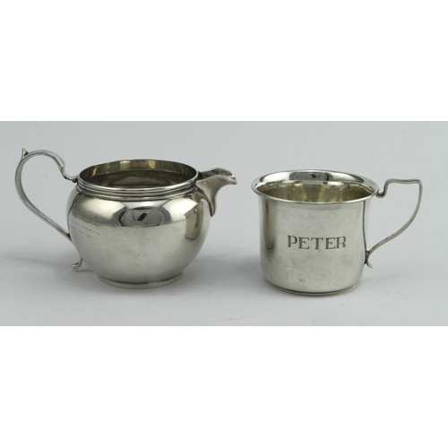 454 - Mixed lot of silver, comprising a silver cream jug hallmarked C&RC London 1925 and a silver mug engr... 