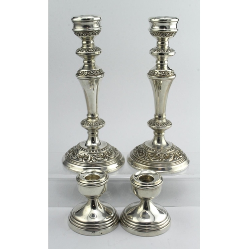 456 - Pair of loaded silver candlesticks, height 9in approx., hallmarked B&Co. Birm 1973, plus 2 dwarf can... 