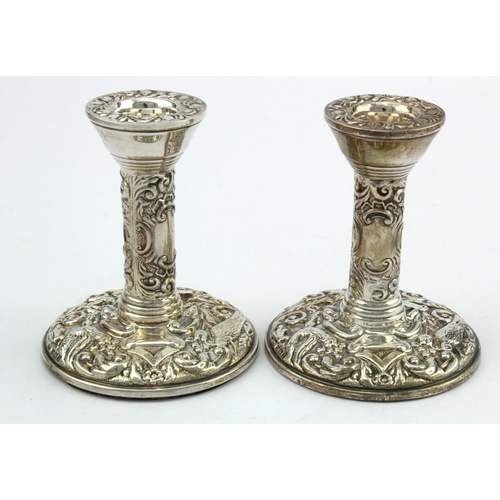 474 - Pair of small silver decorated candlesticks hallmarked B&Co, Birm. 1974 - both have loaded bases