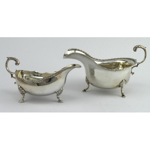 475 - Two silver sauce boats, hallmarked Birm. 1922 and AC & SS Ltd. London 1973. Total weight of both ite... 