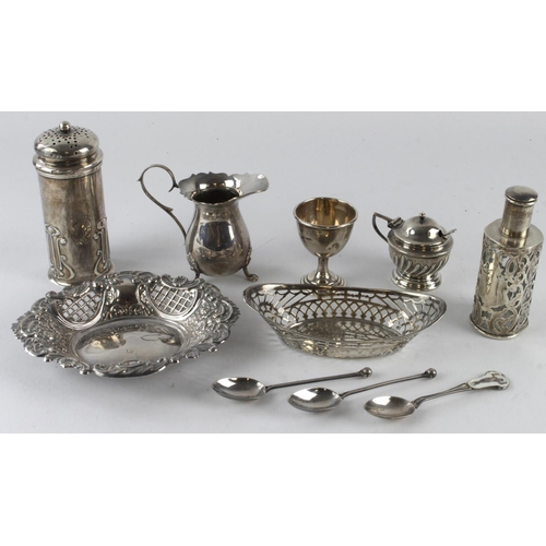 477 - Mixed silver. A collection of various hallmarked silver items, including glass lined perfume bottle,... 