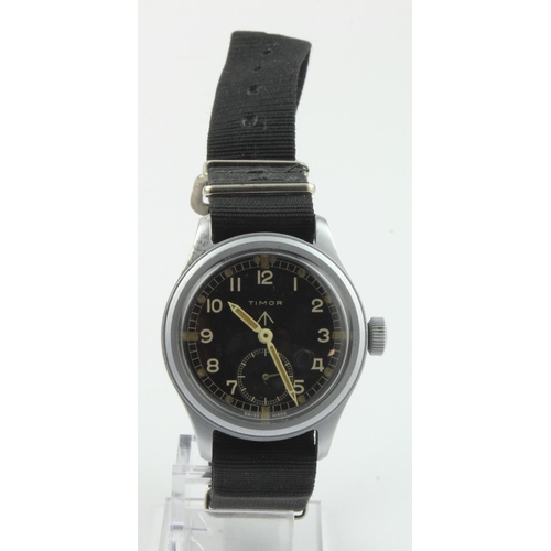 49 - Timor British military issue 'Dirty Dozen' wristwatch. The black dial with white Arabic numerals, br... 