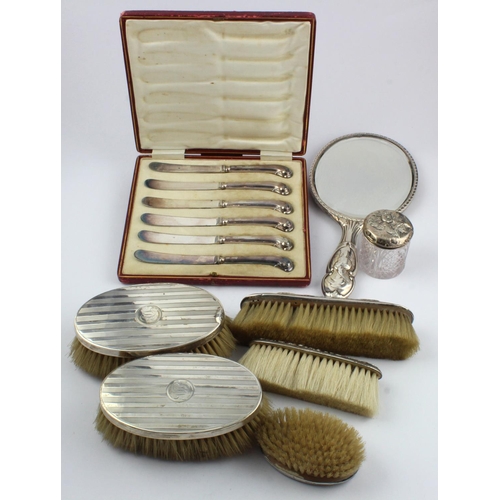 505 - Seven silver vanity items, comprising hand mirror, five brushes and silver topped jar, together with... 