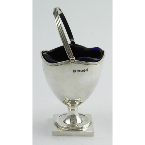 523 - Silver helmet shaped pedestal sugar basket with blue glass liner, hallmarked AMW, London 1977. Weigh... 