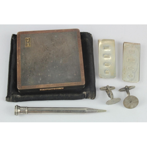 524 - Assortment of silver includes one mechanical pencil, two money clips, pair of cufflinks and one vint... 