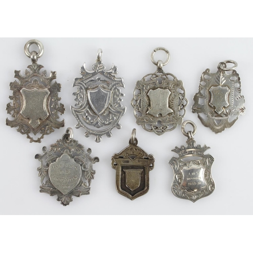 525 - Assortment of seven silver fob medals/pendants, all with a full silver hallmark. Gross weight 74.6g