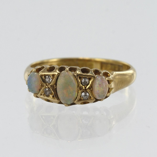 552 - 18ct yellow gold vintage diamond and opal boat shaped ring, principle opal measures 5.5mm x 3.5mm, f... 