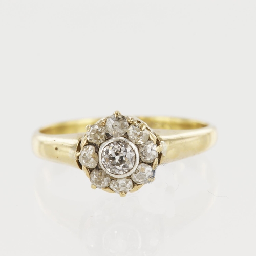 563 - Yellow gold (tests 18ct) diamond cluster ring, principle old cut approx. 0.16ct, surrounded by old c... 