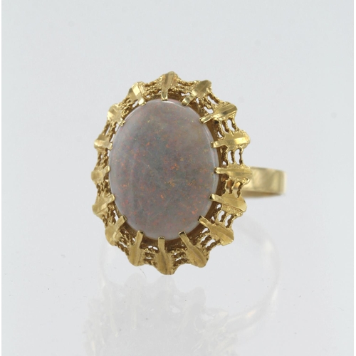 596 - Yellow gold (tests 18ct) opal cocktail ring, opal measures 14mm x 11mm, finger size R, weight 3.9g.