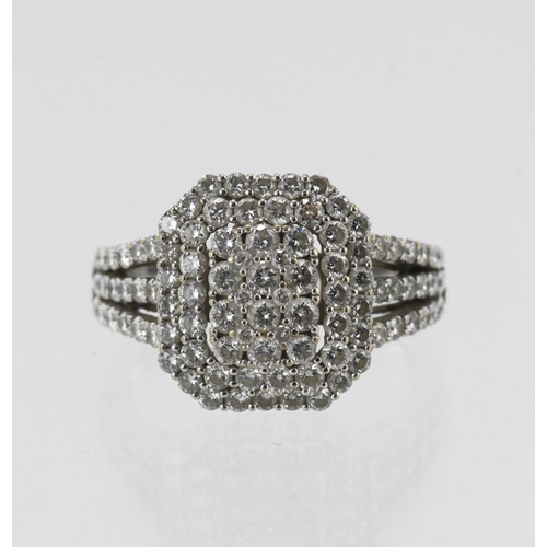 600 - White gold (tests 18ct) diamond cluster ring, ninety-three round brilliant cuts, TDW approx. 1.05ct,... 