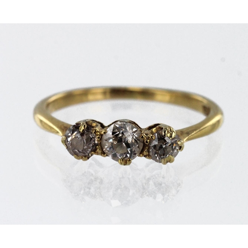 601 - Yellow gold (tests 18ct) diamond trilogy ring, three graduating old cuts TDW approx. 0.60ct, finger ... 