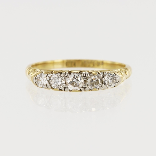 606 - Yellow gold (tests 18ct) vintage diamond ring, five graduating old cuts TDW approx. 0.49ct, carved s... 