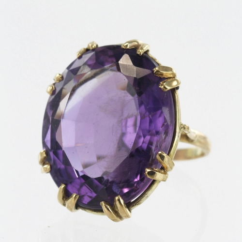 612 - Yellow gold (tests 9ct) amethyst cocktail ring, oval amethyst approx. 26.5ct, measuring 23mm x 19mm,... 