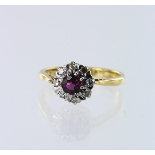 617 - Yellow gold (tests 18ct) diamond and ruby cluster ring, one round ruby approx. 4.5mm, surrounded by ... 