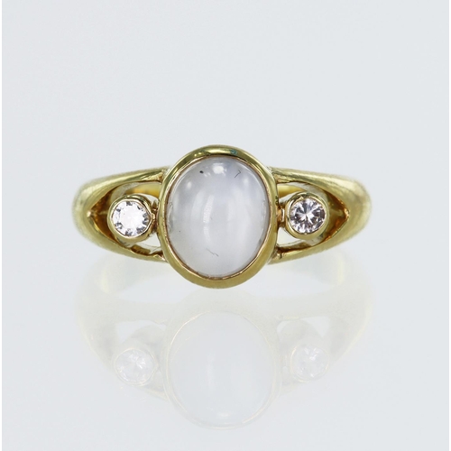 624 - Yellow gold (tests 18ct) star sapphire and CZ ring, oval cabochon star sapphire approx. 4.67ct, meas... 