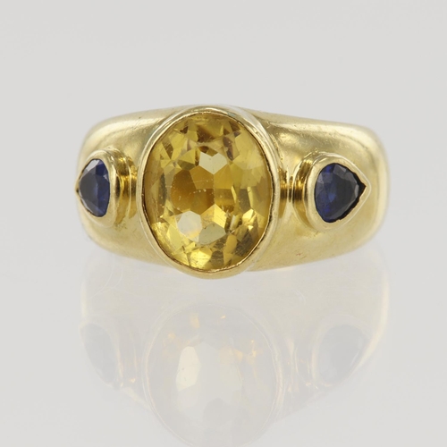 630 - 18ct yellow gold sapphire and citrine trilogy ring, one oval citrine measuring 10mm x 8mm, flanked w... 