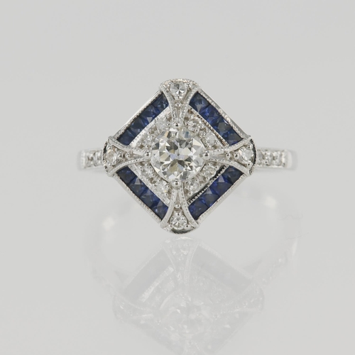 632 - White gold (tests 18ct) diamond and sapphire cluster ring, principle round brilliant cut diamond app... 