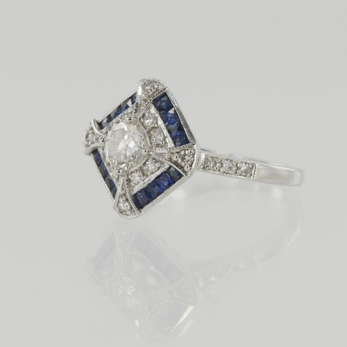 632 - White gold (tests 18ct) diamond and sapphire cluster ring, principle round brilliant cut diamond app... 