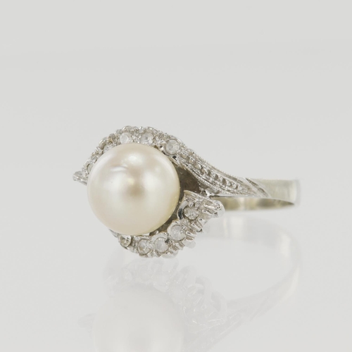 635 - White gold (tests 18ct) pearl dress ring, one cultured pearl approx. 8.5mm, crossover shoulders set ... 