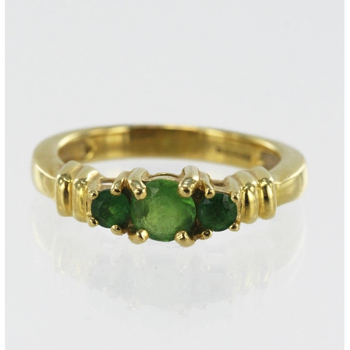 643 - 18ct yellow gold tsavorite trilogy ring, three graduating round cuts TGW 0.606ct, principle stone 5m... 