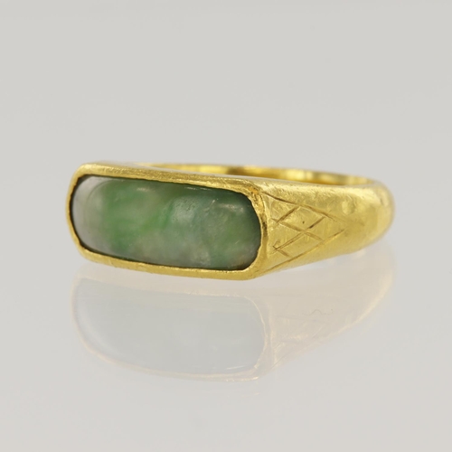 645 - Yellow gold (tests 24ct) jade dress ring, jadeite jade measures 19mm x 7mm, bezel setting, Interior ... 