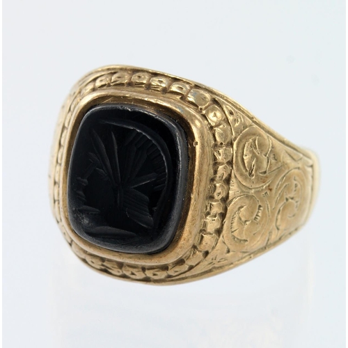 654 - 9ct yellow gold hematite college style ring, set with a hematite intaglio measuring 11.5mm x 9mm, fi... 