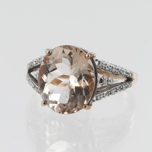 662 - Rose gold (tests 18ct) diamond and morganite cocktail ring, oval morganite approx. 4.65ct, measures ... 