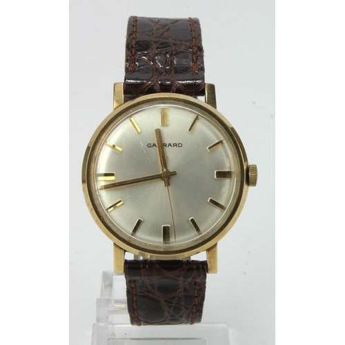 69 - Gents 9ct cased Garrard manual wind wristwatch, hallmarked London 1971. The silvered dial with gilt ... 