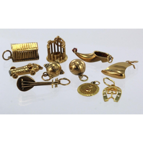 793 - Ten yellow gold (tests 18ct) novelty charms, total weight 16.9g.