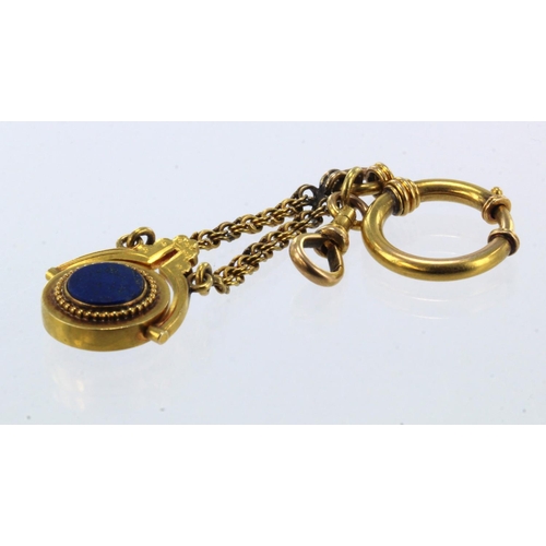 797 - Yellow gold (tests 15ct) antique swivel fob, set with lapis lazuli, suspended from a fancy linked ch... 