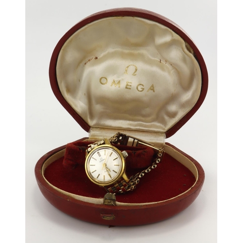 80 - Ladies gold plated Omega Geneve manual wind wristwatch. The  silver dial with black baton markers an... 