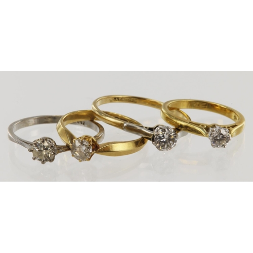 801 - Four 18ct gold/tests 18ct diamond solitaire rings, diamond carat weight approx. 0.24ct, 0.30ct, 0.35... 