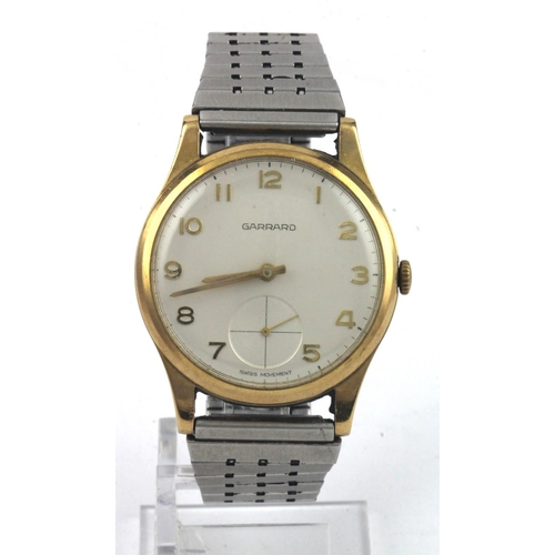 9 - Gents 9ct cased Garrards wristwatch. Hallmarked 1972. The cream dial with arabic numeral and subsidi... 