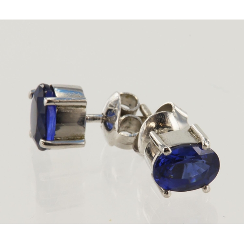 925 - Pair of white gold (tests 18ct) sapphire solitaire stud earrings, one oval sapphire approx. 7mm x 5m... 