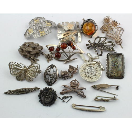 934 - Seventeen silver (tests silver) brooches/pendants, stones include amber, opal chips, marcasite, crys... 